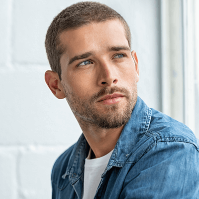 Man gazing over his shoulder.