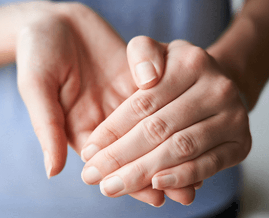 Photo showing person rubbing hands.